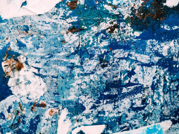 istock Vintage old posters sticked and torn on wall for your grunge background 1267107057
