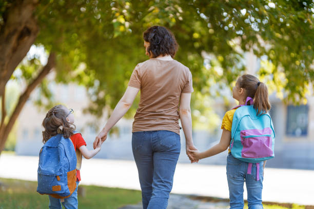istock Parent and pupils go to school 1267107140
