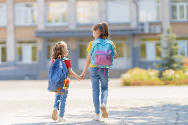 istock Girls with backpack are going to school 1267107152