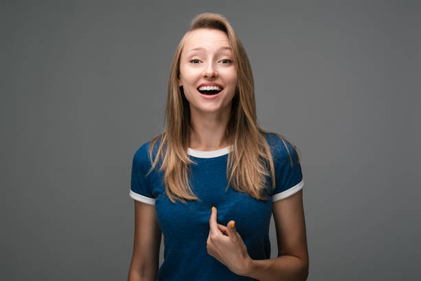 istock Woman points at herself with forefinger. Human emotions, facial expression concept. 1267108204
