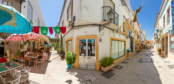 Silves, Portugal - August 14, 2020: panoramic downtown view of old town of Silves with typical small portugese restaurants and shops.