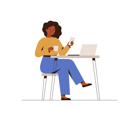 Black Woman chatting on a smartphone sitting at the cafe table. Happy freelancer or office female working remotely use a laptop.