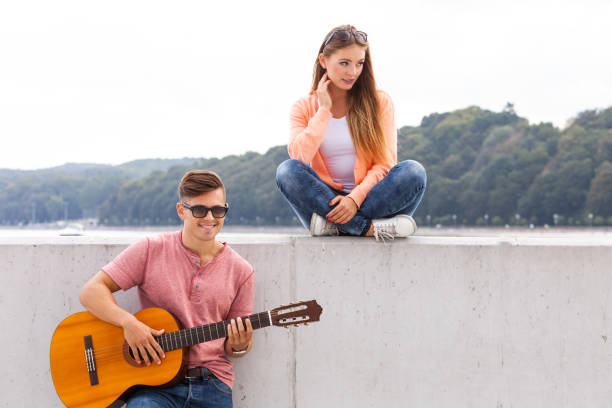istock Cheerful couple spending time on coast. 1267111088