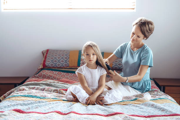 istock Mother and daughter, hair braid 1267111118