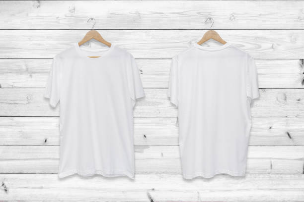 istock White blank front and back t-shirt on white wood wall background. 1267111538