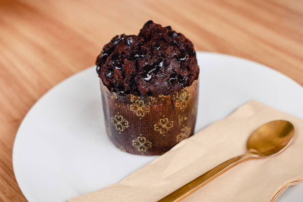 istock chocolate muffin with chocolate chips  on white plate 1267112414