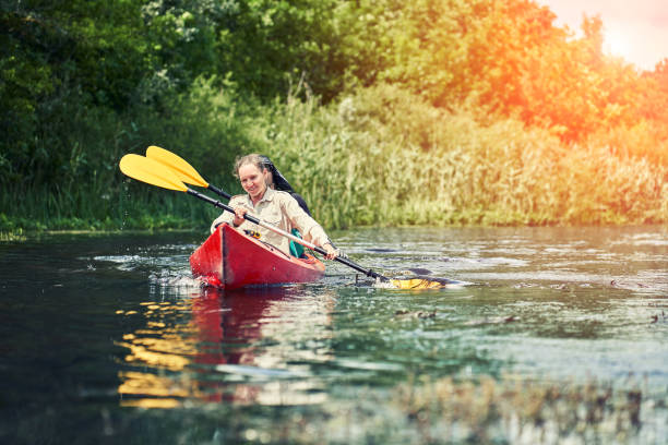 istock Happy best friends having fun on a kayaks. Kayaking on the river. 1267112622