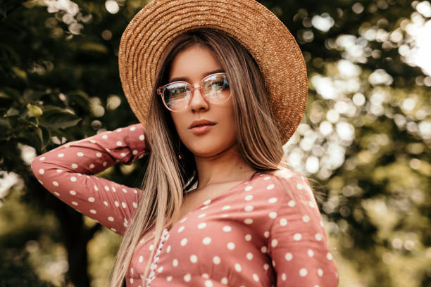 istock Stylish young woman in summer park 1267112739