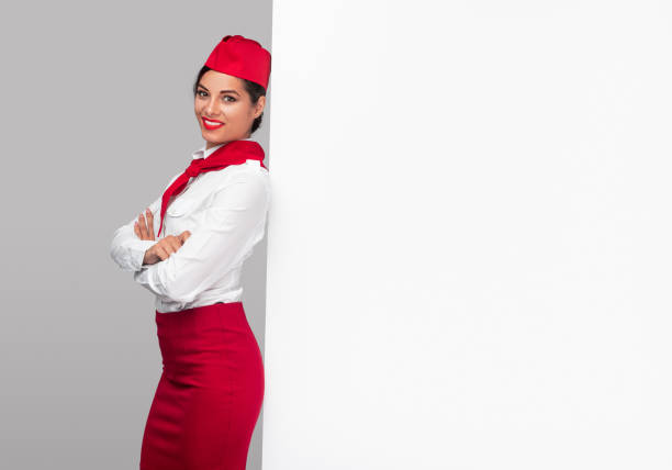 istock Joyful confident stewardess in vibrant uniform 1267112796