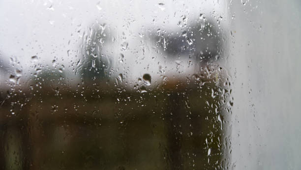 istock Droplets of water from rain on the window 1267113957
