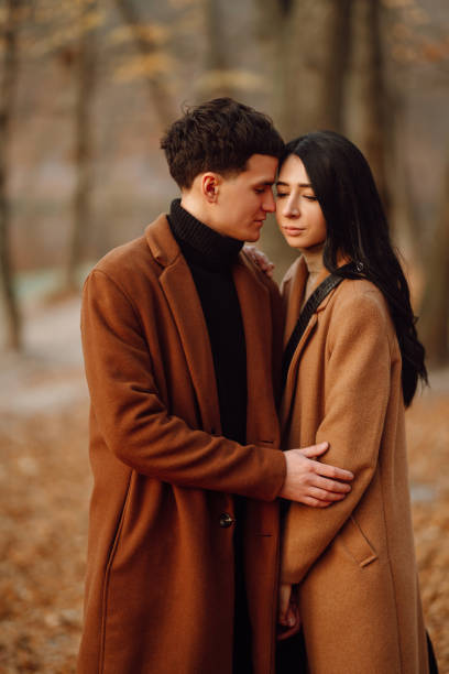 istock Couple in the autumn park. 1267114148