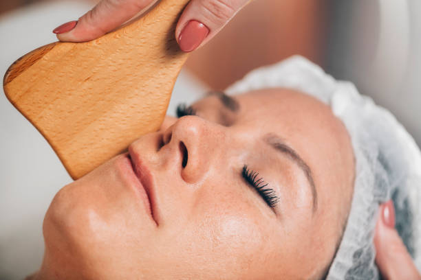 istock Face Massage with Wooden Gua Sha Plate Shape Massager 1267114711