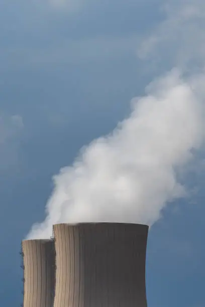 A vertical shot of nuclear power plant cooling towers