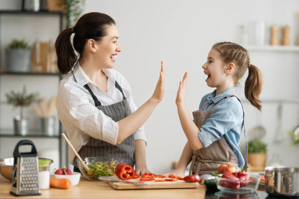 istock Happy family in the kitchen. 1267116994