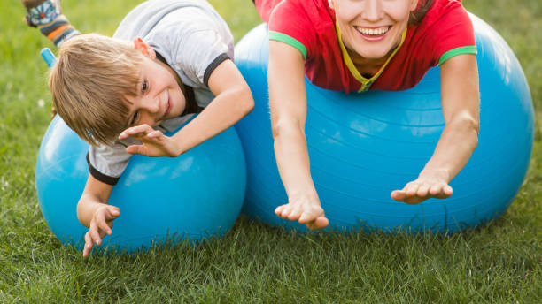 istock Mother and son exercising outdoors on a sunny day 1267117837