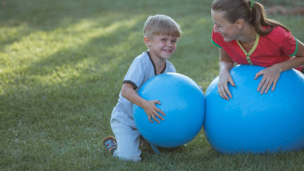 istock Mother and son exercising outdoors on a sunny day 1267117862