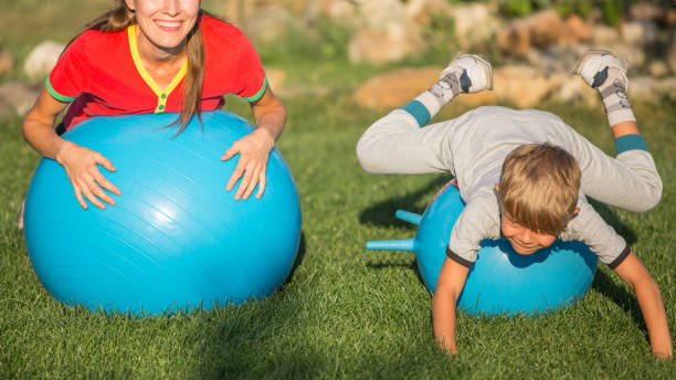 istock Mother and son exercising outdoors on a sunny day 1267117872