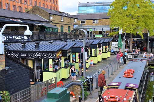 London, United Kingdom - August 1 2020: Camden Market stalls and houseboats