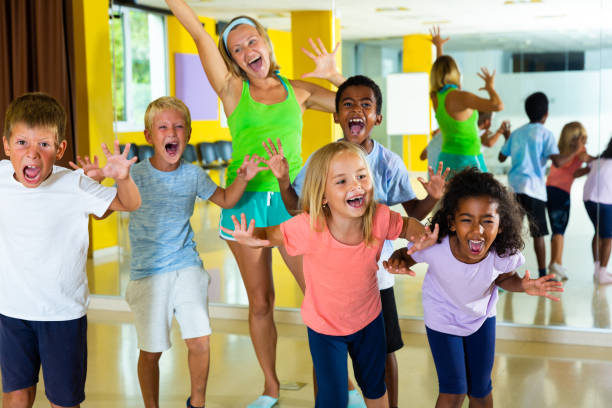 istock Happy children in dance studio smiling and having fun 1267121481
