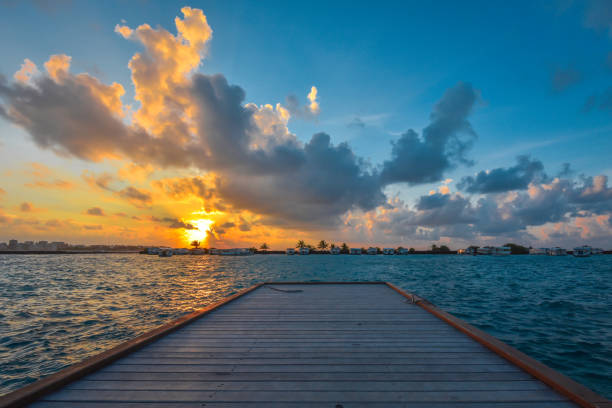 istock Maldives cloudy sunset from the dock 1267121585