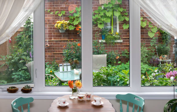 istock Vintage style tea table by the window facing a garden 1267122485