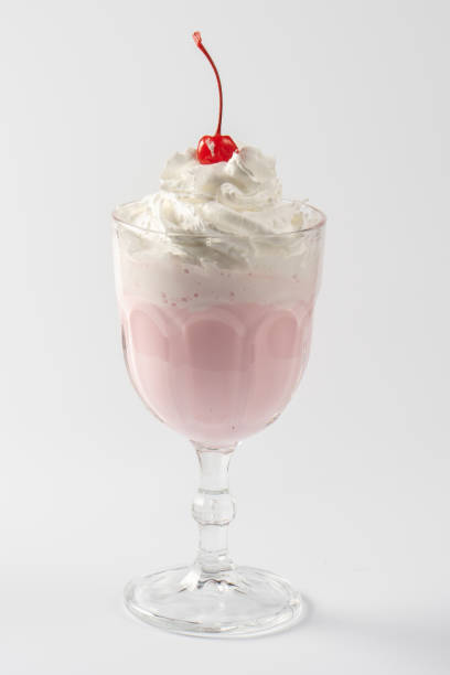 istock Cherry milk protein shake, with whipped cream and cherry syrup on a white plate. 1267125739