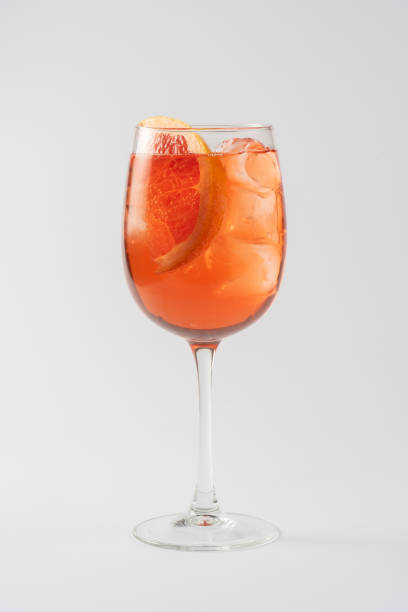 istock Alcoholic cocktail aperol syringe with grapefruit in glass goblet on white background 1267125754