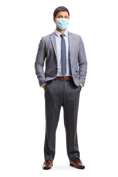 istock Young man in corporate wear wearing a protective face mask 1267128769