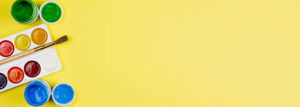 istock Paints for painting on a yellow background. 1267130291