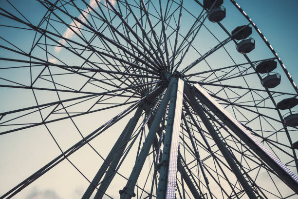 istock Ferris Wheel with Blue Sky and clouds 1267130673