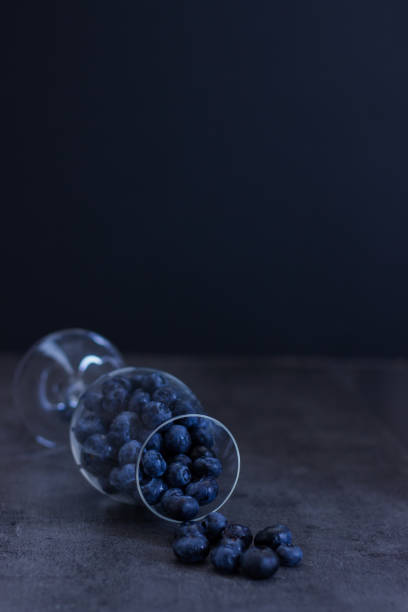 istock blueberries falling out of wineglass 1267131872