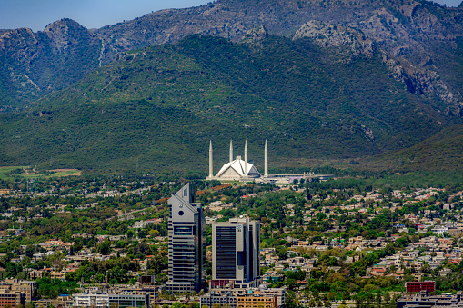 The Faisal Mosque is a mosque in Islamabad, the federal national capital city of the Islamic Republic of Pakistan. It is the fifth-largest mosque in the world and the largest mosque in Pakistan, as well as its national mosque. It is located on the foothills of Margalla Hills in Islamabad