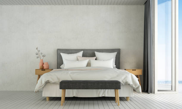 The modern loft bedroom design interior and concrete wall texture and sea view