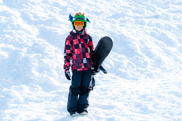 istock Portrait of Boy with Snowboard 1267133190