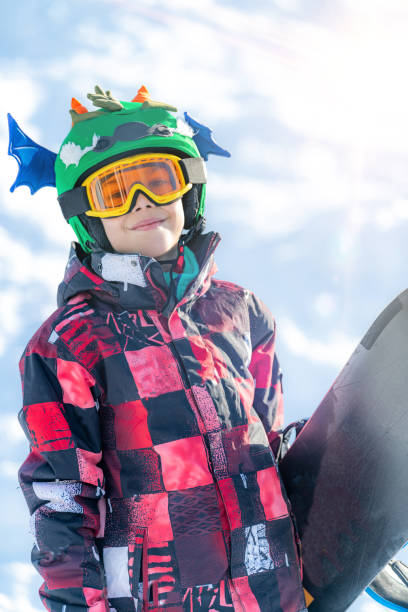 istock Portrait of Boy with Snowboard 1267133269