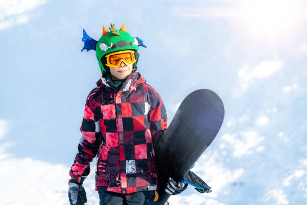 Portrait of Boy with Snowboard