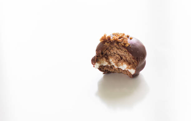 istock Homemade bitten chocolate pie with crumble on top on the white background 1267135391