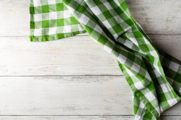 istock Green kitchen towel on white table, italian food background 1267137304