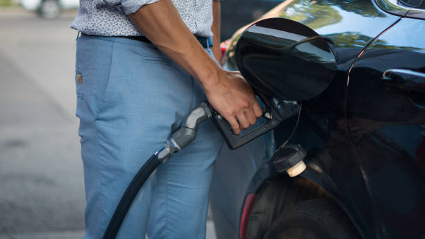 istock Man Fills Gas Tank 1267137435