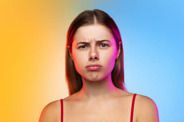 istock Caucasian young woman's portrait on gradient studio background in neon 1267138809