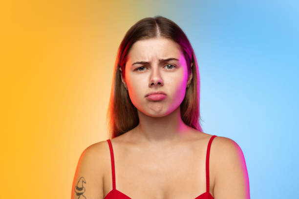 istock Caucasian young woman's portrait on gradient studio background in neon 1267138818