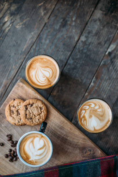 Coffee and cake on the table in a cafeteria. Latte Art