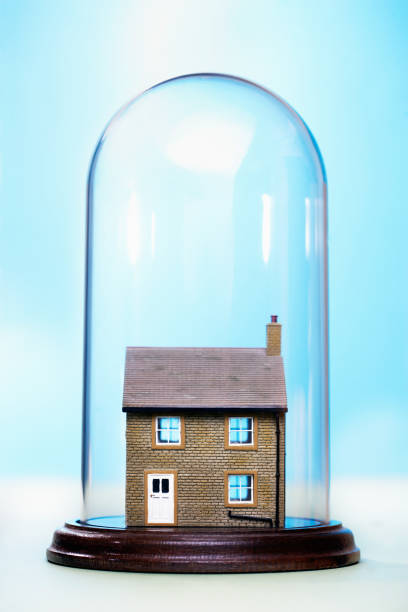 istock Ceramic house under glass cover 1267141960