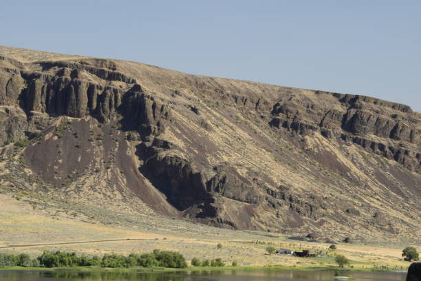 istock Slanted Rock Formation In Desert Against Clear Blue Sky 1267144153