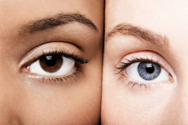 istock Black and white female putting faces together showing diversity 1267147143