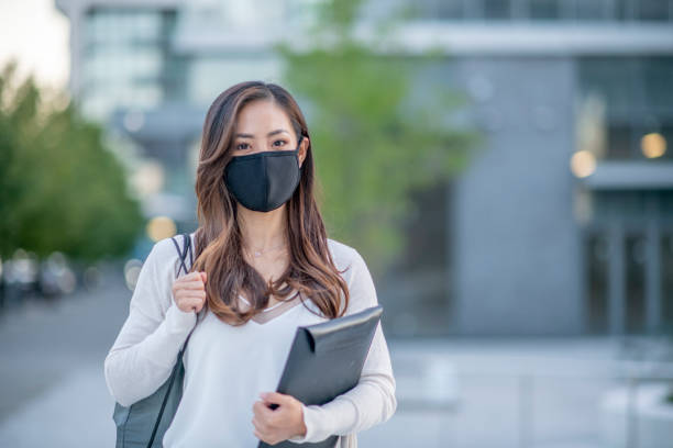 istock University student wearing face mask 1267147995
