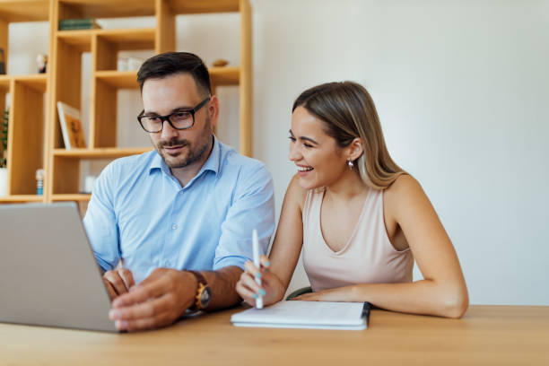 istock Close-up image of two business people working together. 1267148499