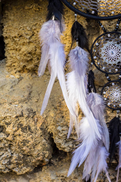 istock Handmade dream catcher with feathers threads and beads rope hanging 1267149360
