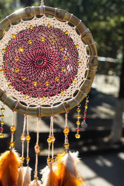 istock Handmade dream catcher with feathers threads and beads rope hanging 1267149361