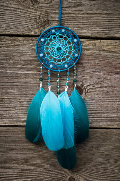 istock Handmade dream catcher with feathers threads and beads rope hanging 1267149409